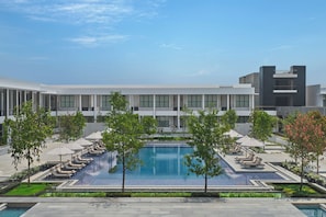Outdoor pool, open 7:00 AM to 7:00 PM, pool umbrellas, pool loungers