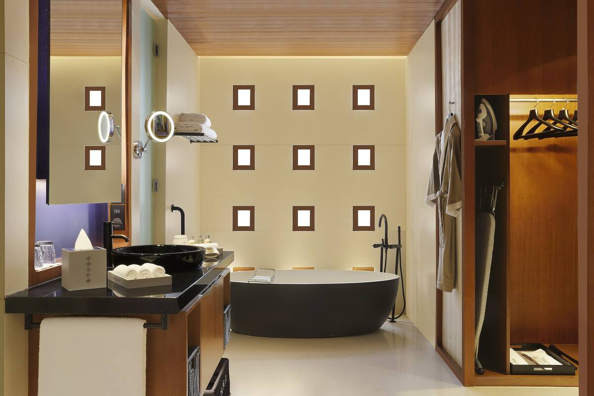 separate bathtub and shower, deep-soaking bathtub, rainfall showerhead