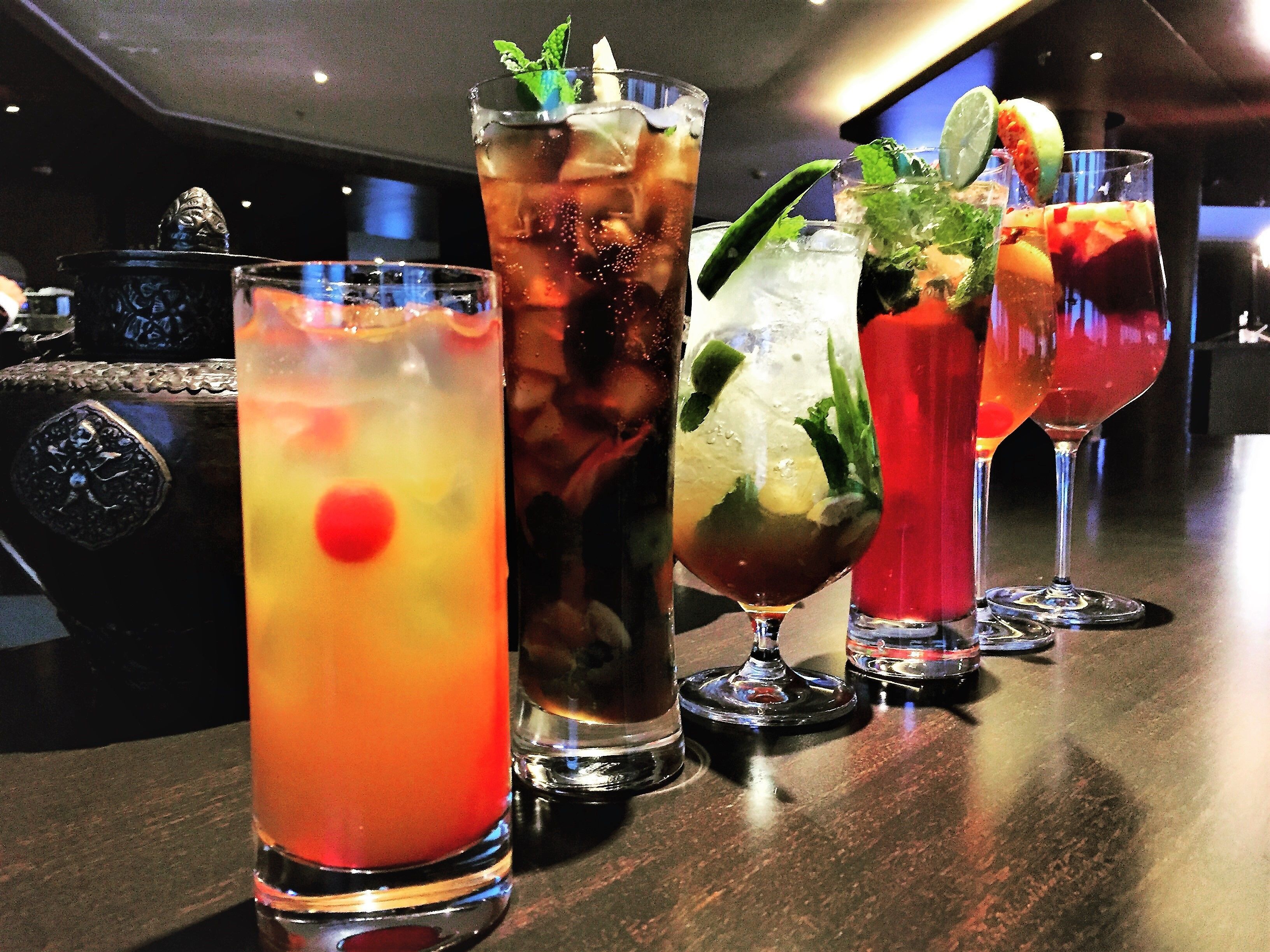 A bar with various cocktails.