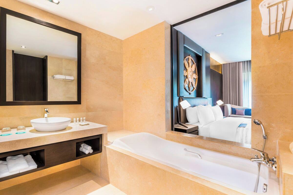 separate bathtub and shower, deep-soaking bathtub, designer toiletries