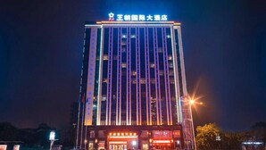 A tall hotel building with illuminated signage at the top.