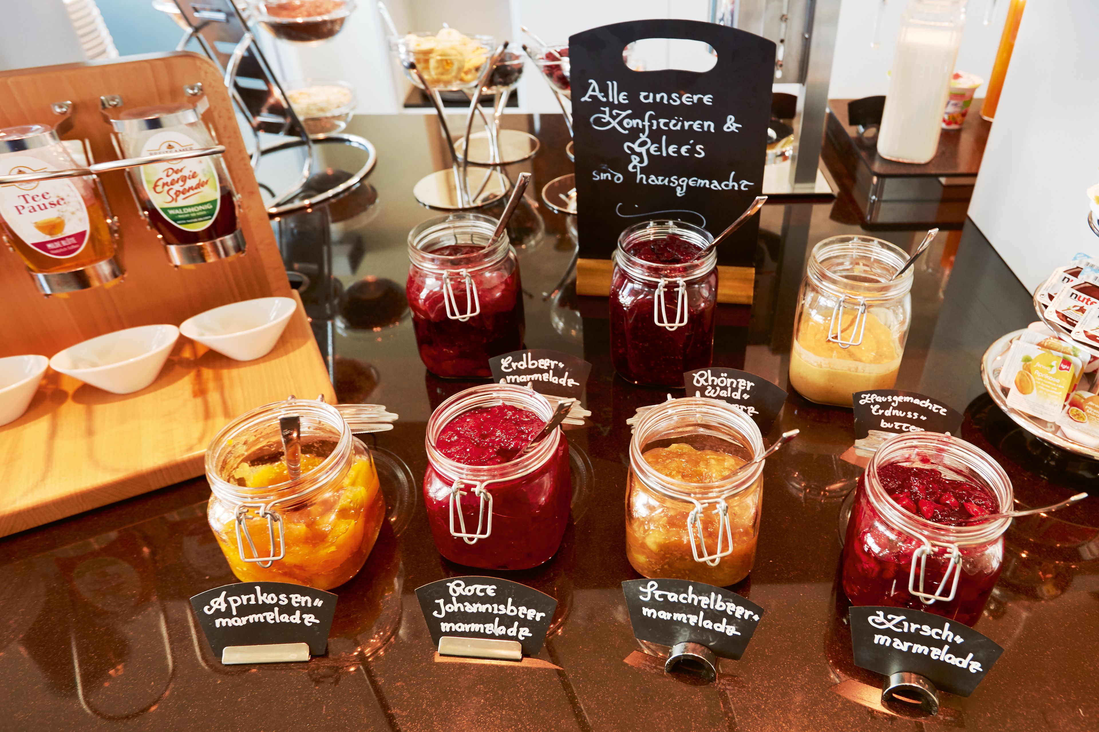 A variety of jars labeled with different types of marmalade.