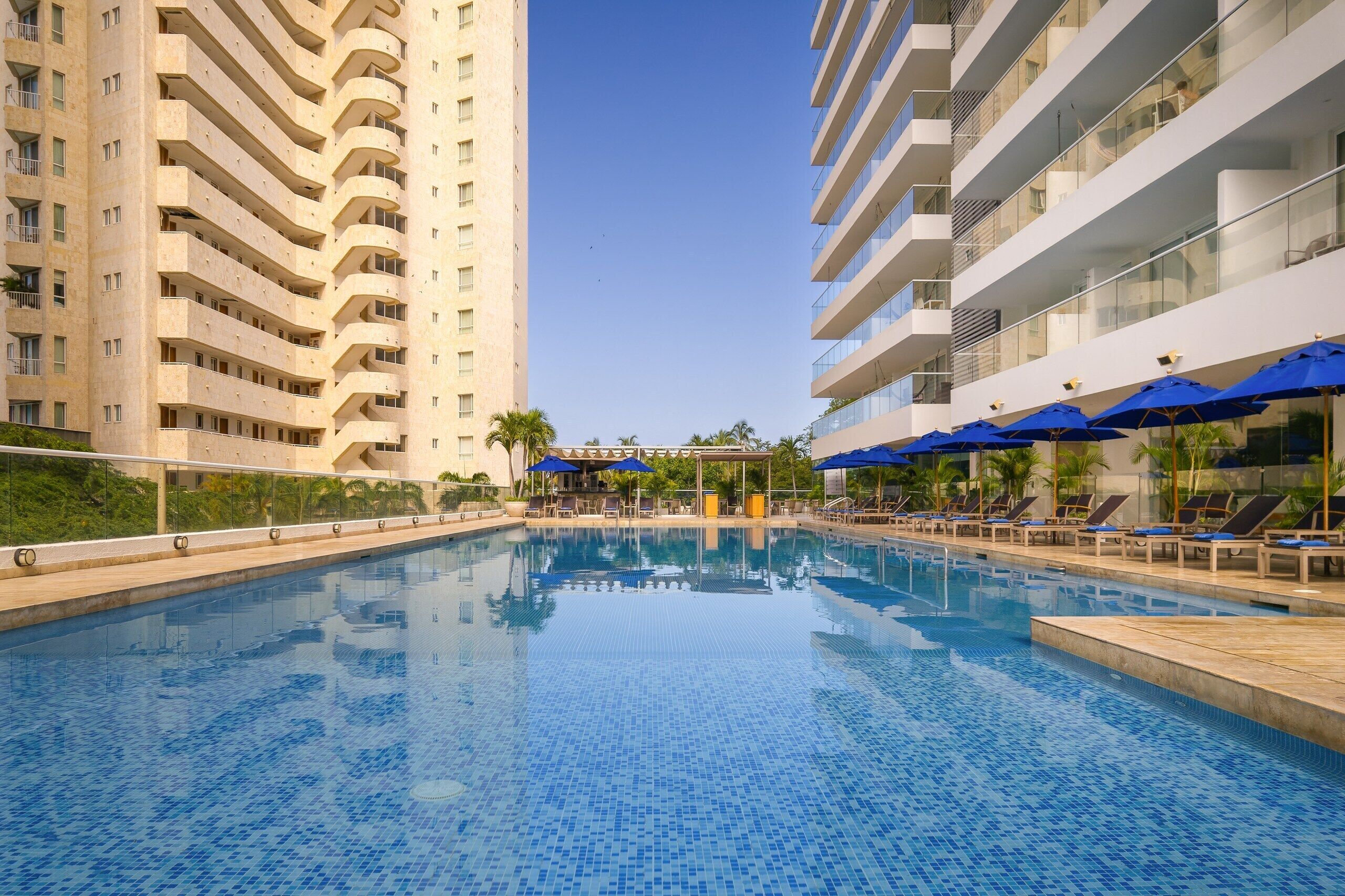 Outdoor pool, open 9:00 AM to 9:00 PM, pool loungers