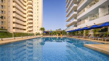 Outdoor pool, open 9:00 AM to 9:00 PM, pool loungers