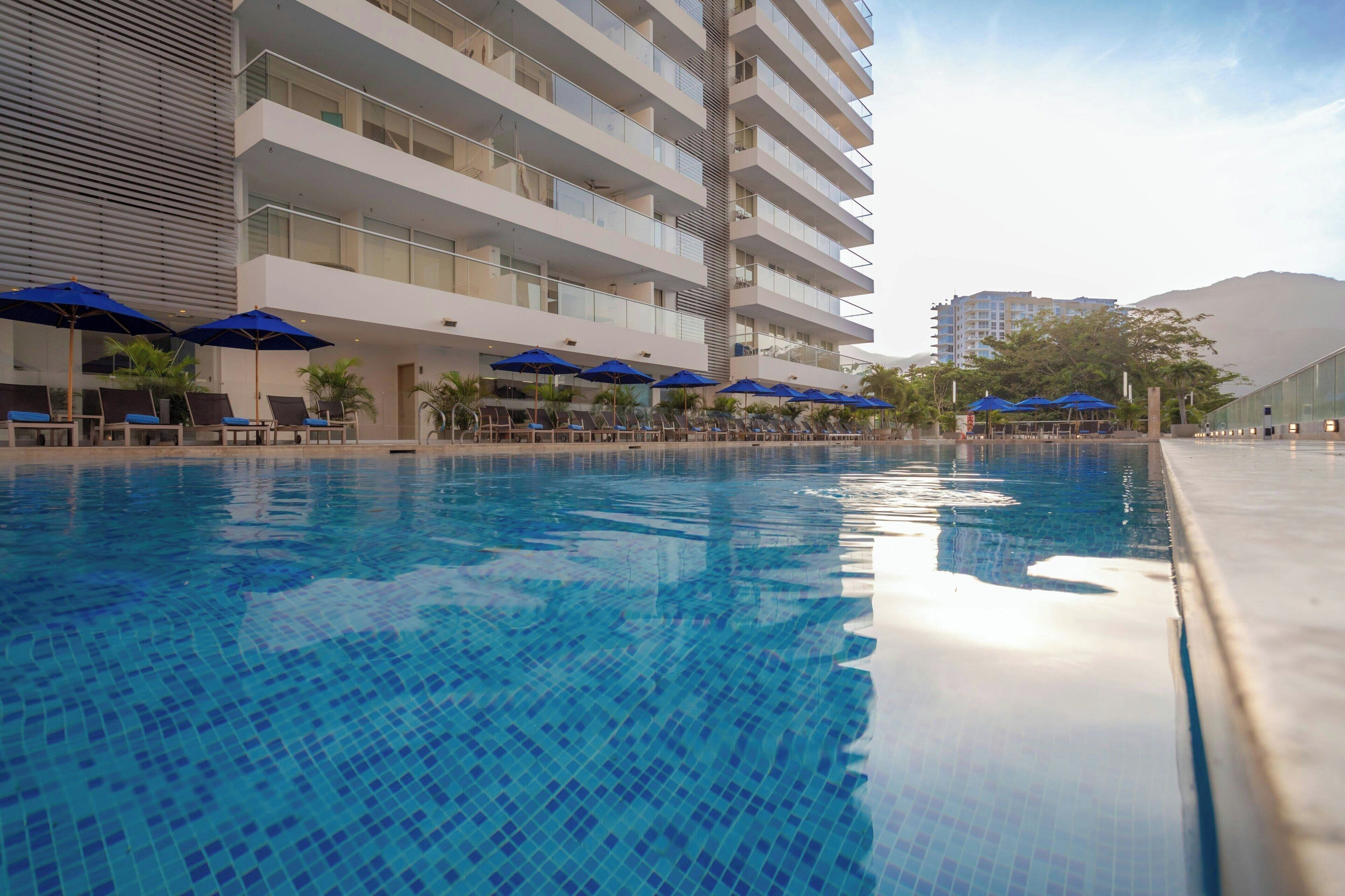 Outdoor pool, open 9:00 AM to 9:00 PM, pool loungers