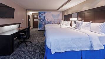 Premium bedding, desk, laptop workspace, blackout drapes