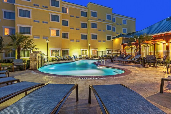 Outdoor pool, open 10:00 AM to 10:00 PM, pool loungers