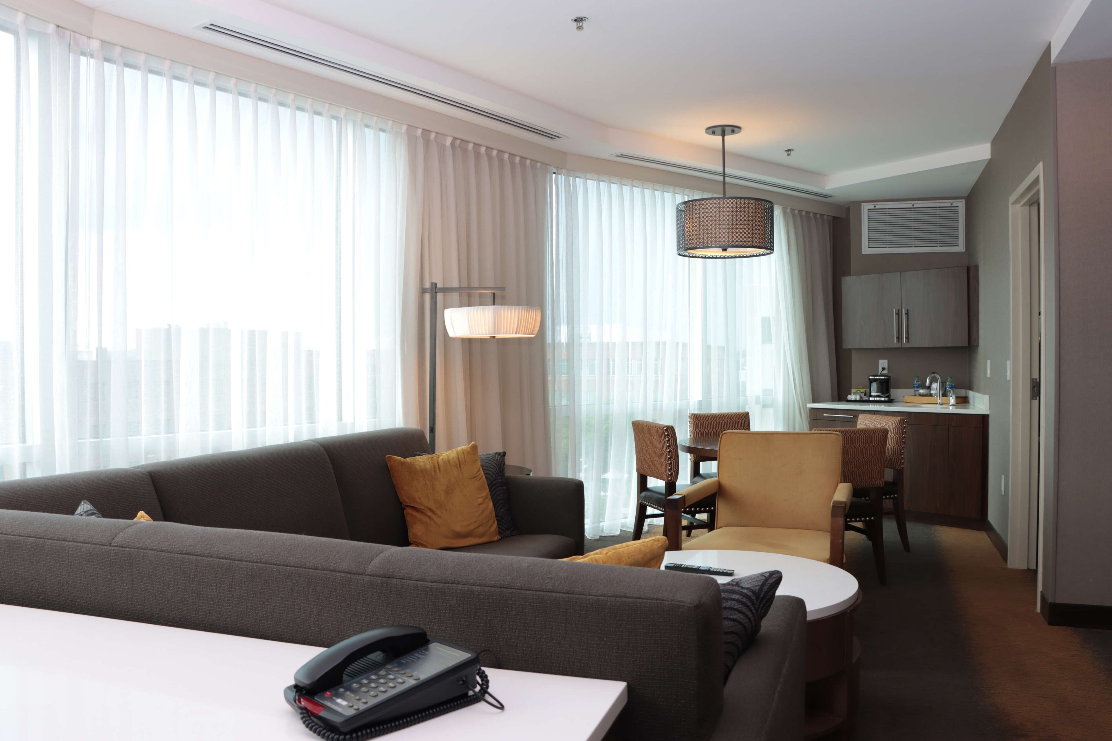 king, suite | living area | 42-inch flat-screen tv with cable channels, tv, ipod dock