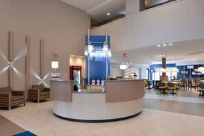 A spacious lobby with a reception desk, seating area, and a staircase. - Holiday Inn Express & Suites Shippensburg by IHG (Shippensburg)
