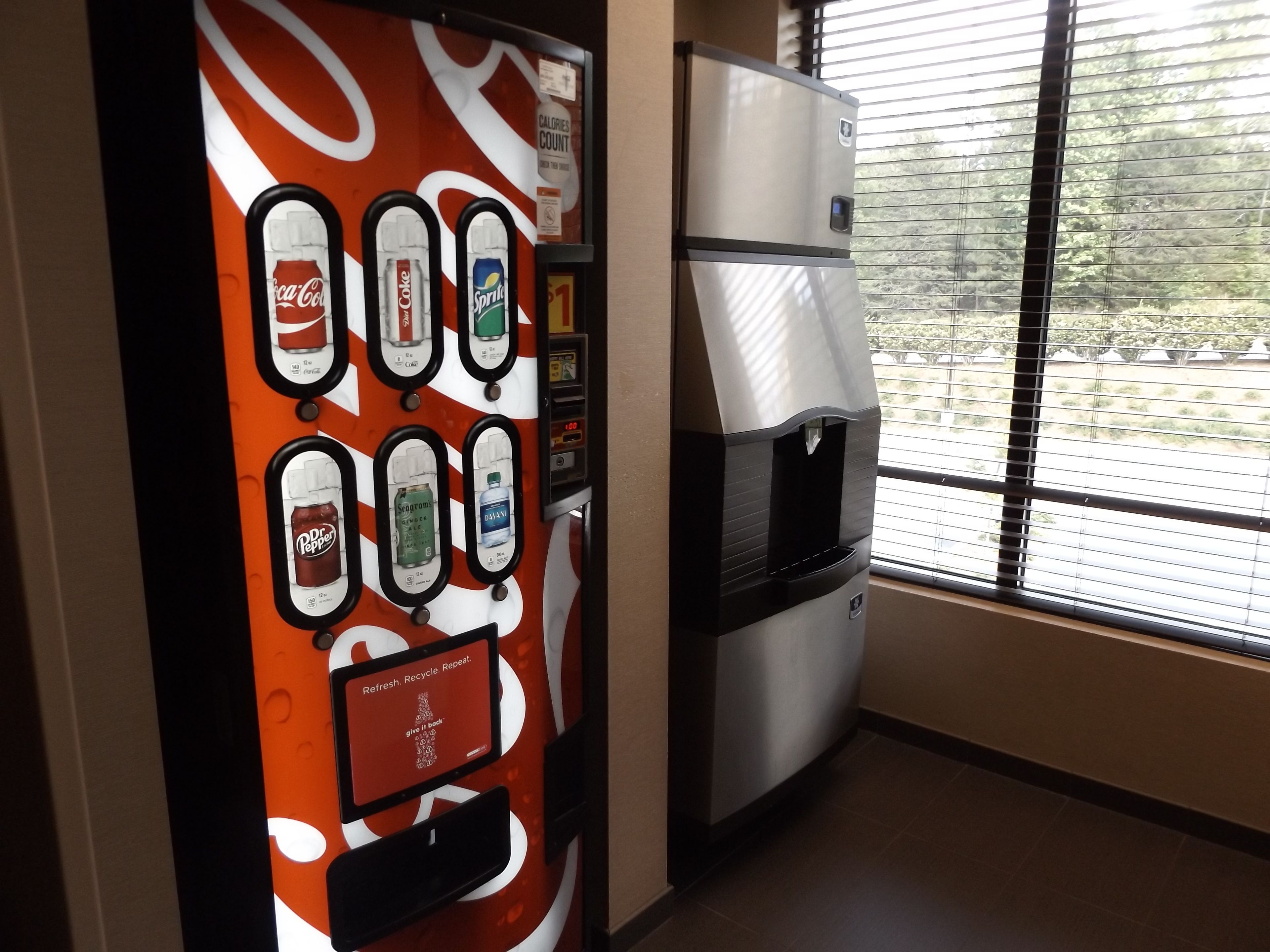 A vending machine with various drink options and a water dispenser.