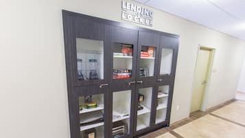 A Lend-A-Lot Locker with multiple compartments, some containing board games and other items.