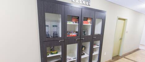 A Lend-A-Lot Locker with multiple compartments, some containing board games and other items.