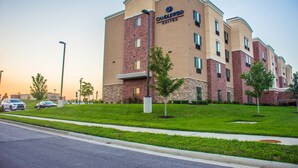 A multi-story hotel with a brick facade, multiple windows, and a flat roof. - Candlewood Suites : Overland Park - W 135th St by IHG (Overland Park)