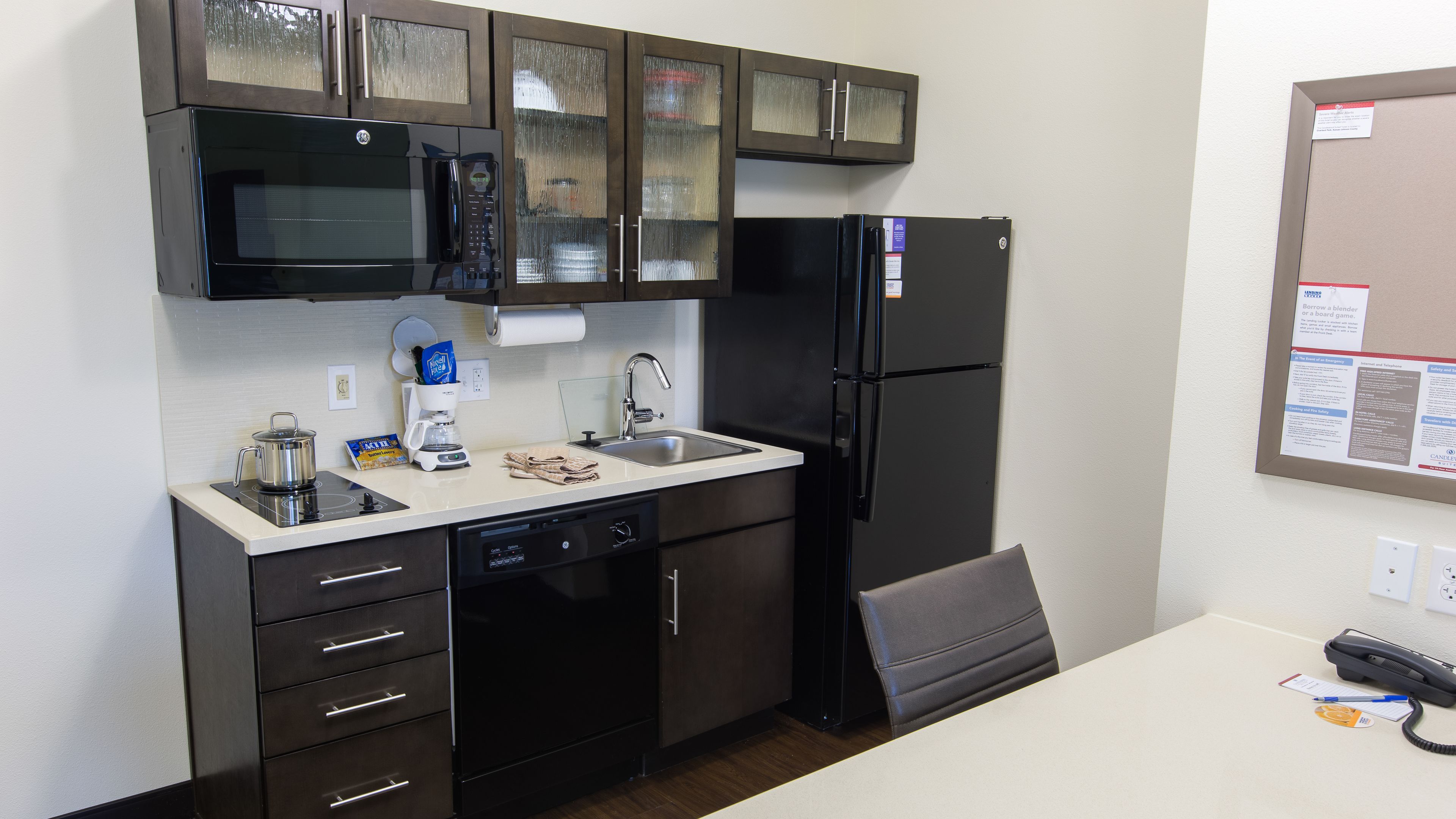 full-sized fridge, microwave, stovetop, dishwasher