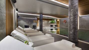 Relax in our serene spa area, featuring massage chairs, plants, and a calming atmosphere.