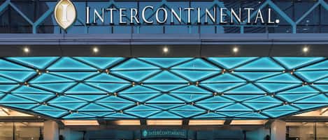 The InterContinental hotel entrance with a geometric glass ceiling design.