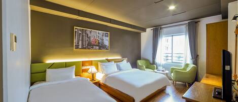 Deluxe Triple Room with complimentary daily snack | Minibar, in-room safe, desk, laptop workspace