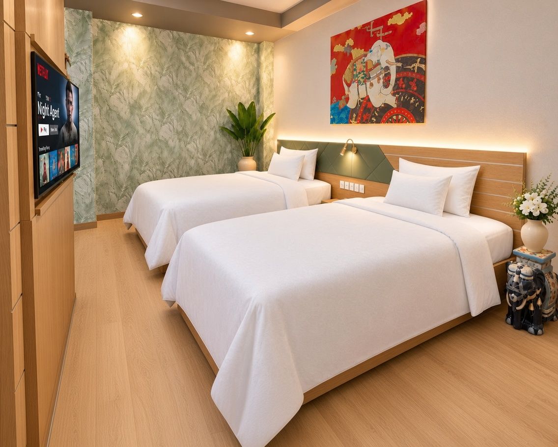 A hotel room with two beds, a television displaying a show, a decorative painting, and a plant.