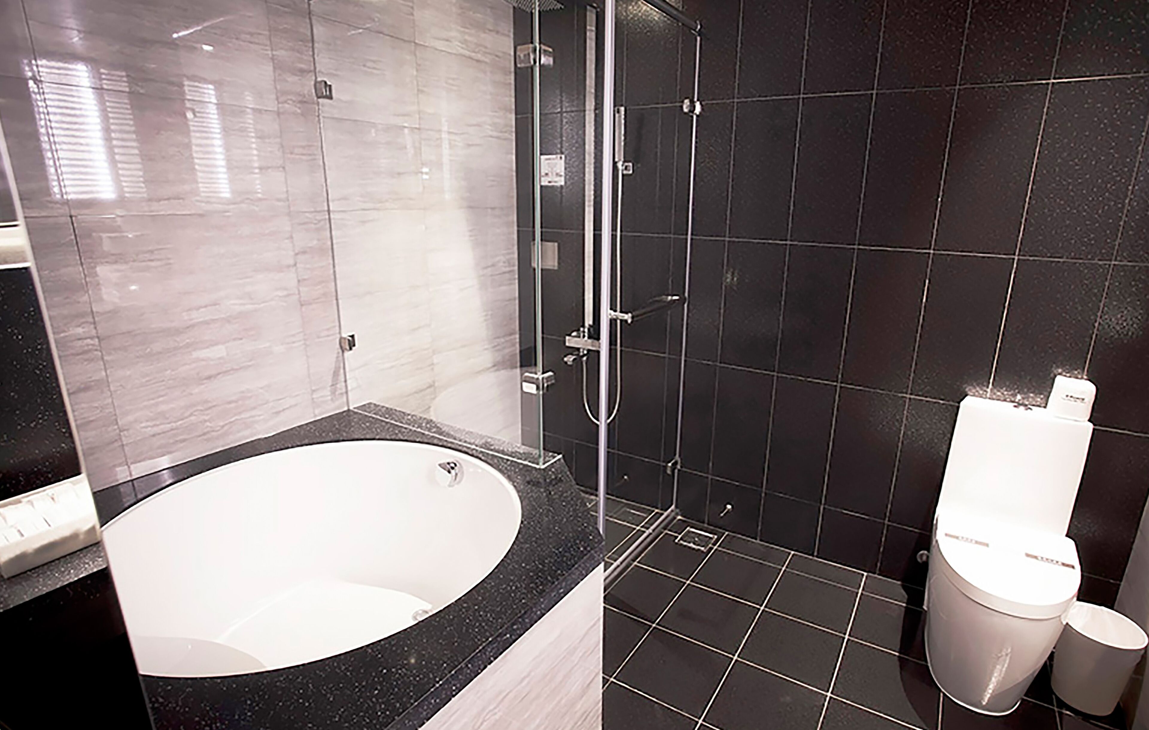 superior quadruple room | bathroom | separate bathtub and shower, free toiletries, hair dryer, slippers