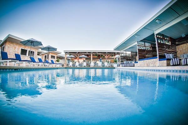 Outdoor pool, free cabanas, pool umbrellas