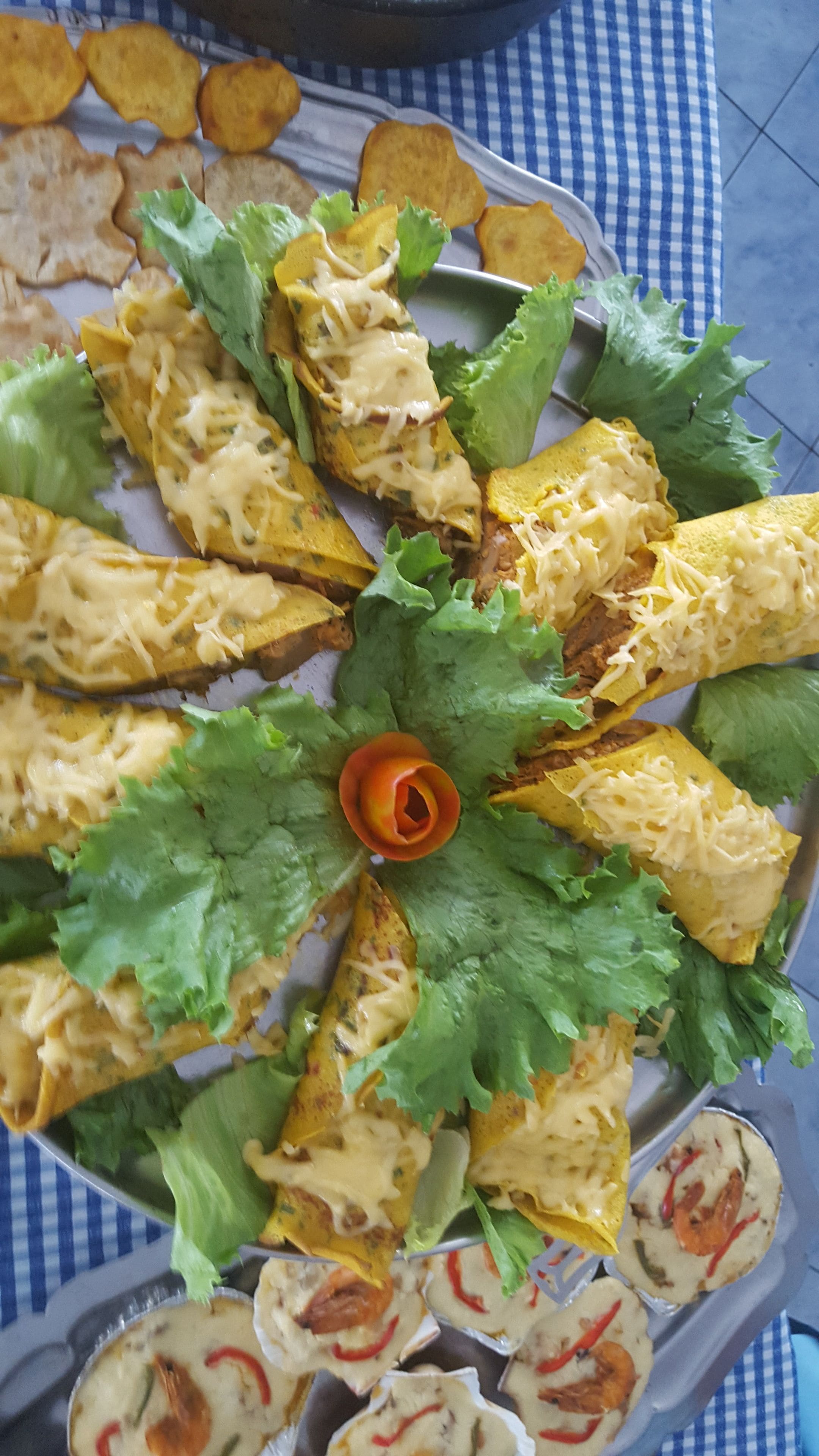 A plate of food with tortillas, cheese, and lettuce.