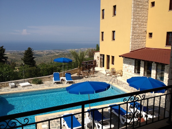 Outdoor pool, pool umbrellas, pool loungers