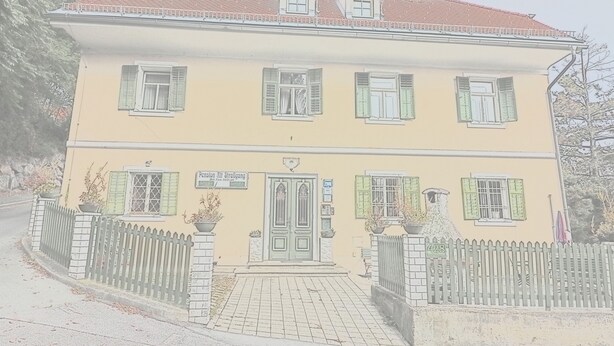 A two-story building with a yellow facade, green shutters, and a brick entrance. - Pension Alt-Strassgang (Graz)