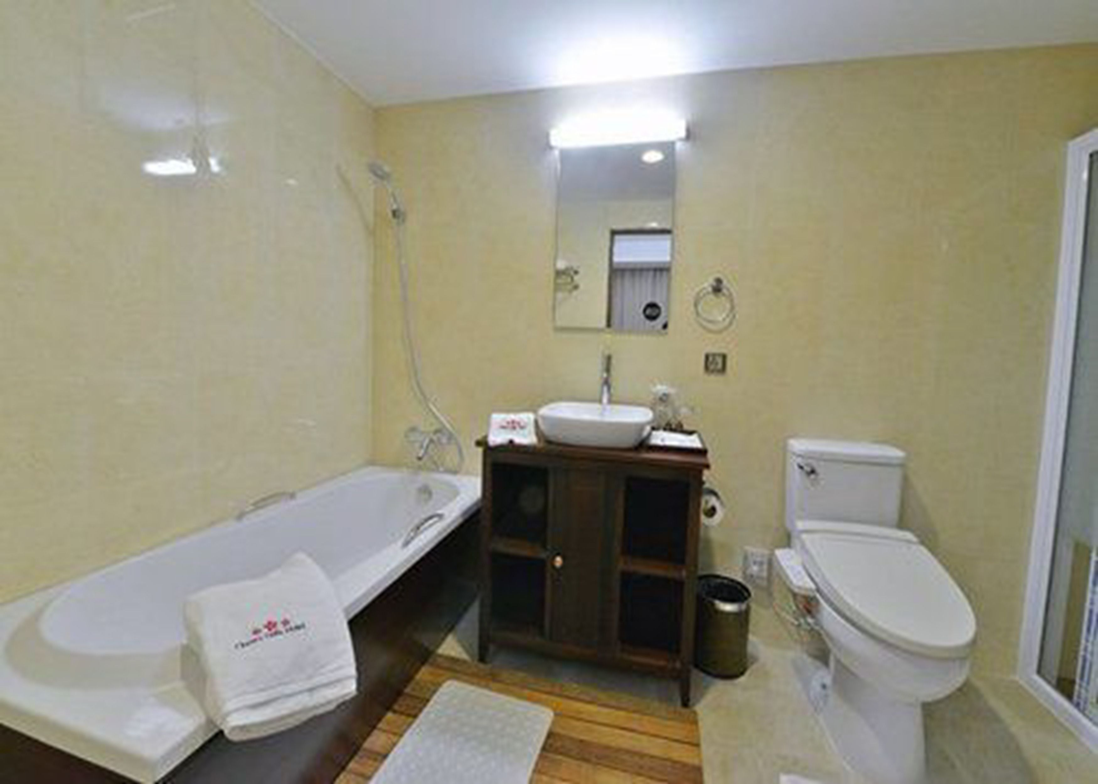 cherry deluxe room | bathroom | separate bathtub and shower, deep-soaking bathtub, rainfall showerhead