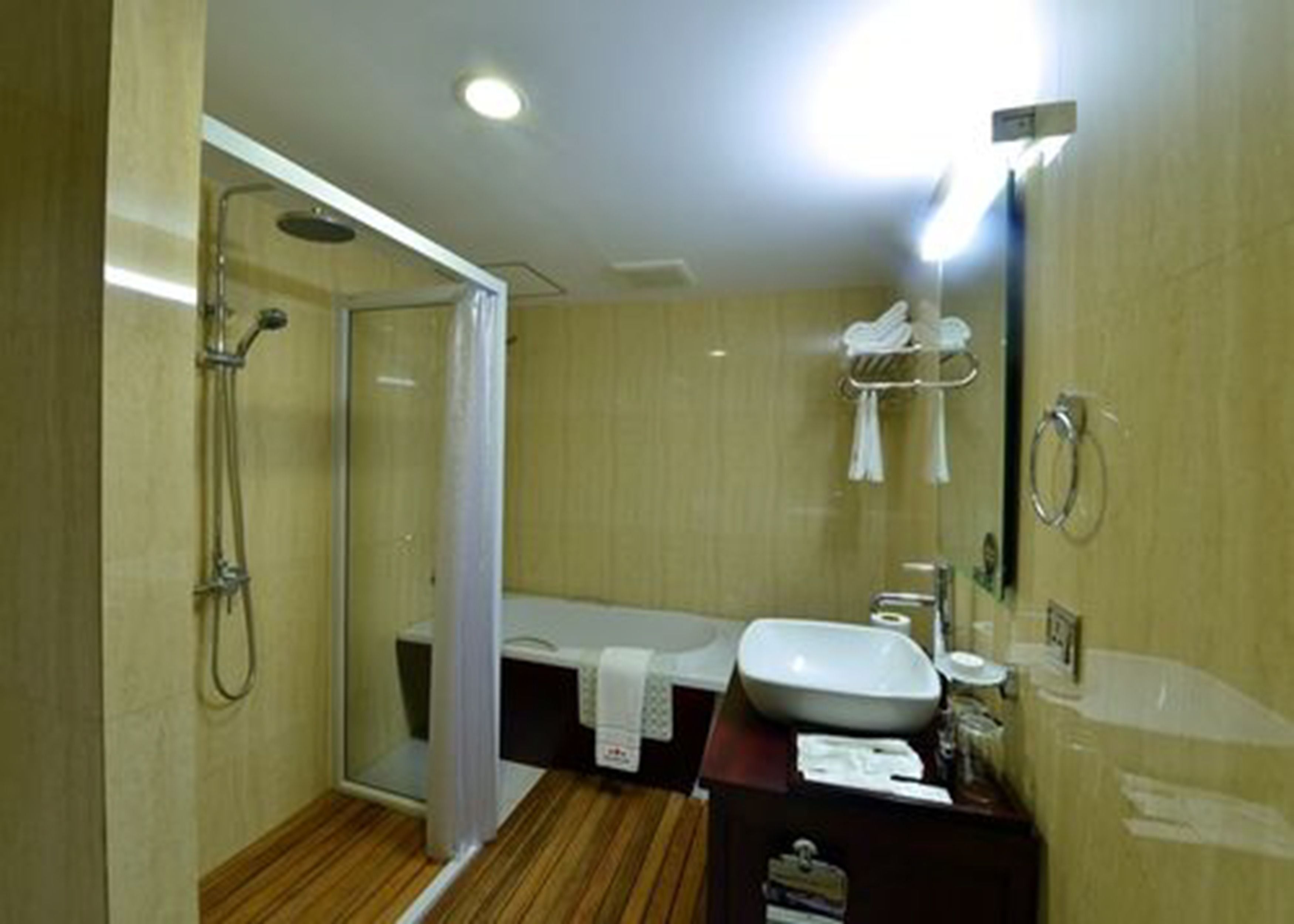 cherry deluxe plus room | bathroom | separate bathtub and shower, deep-soaking bathtub, rainfall showerhead