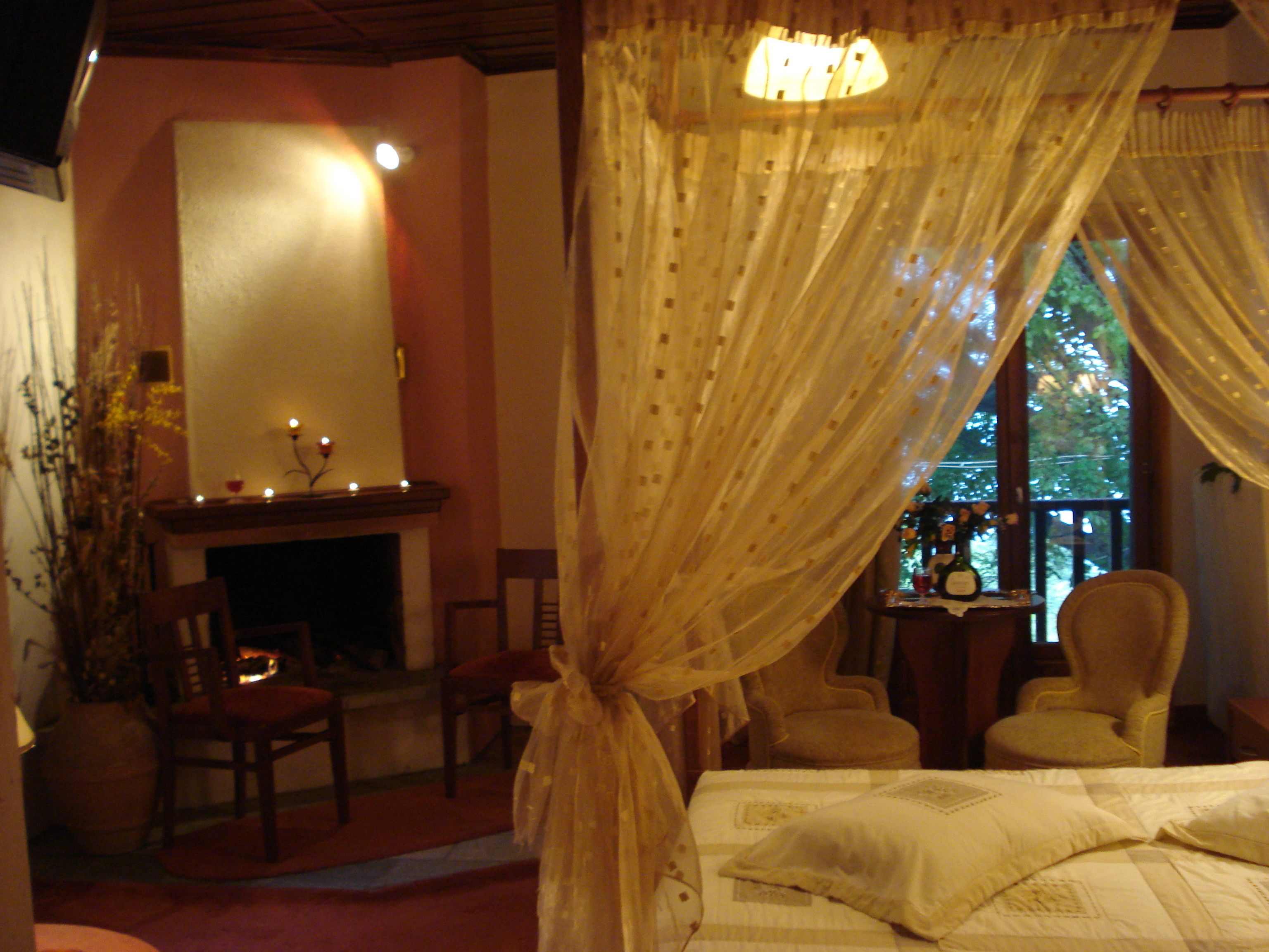 junior suite, fireplace, sea view | desk, bed sheets