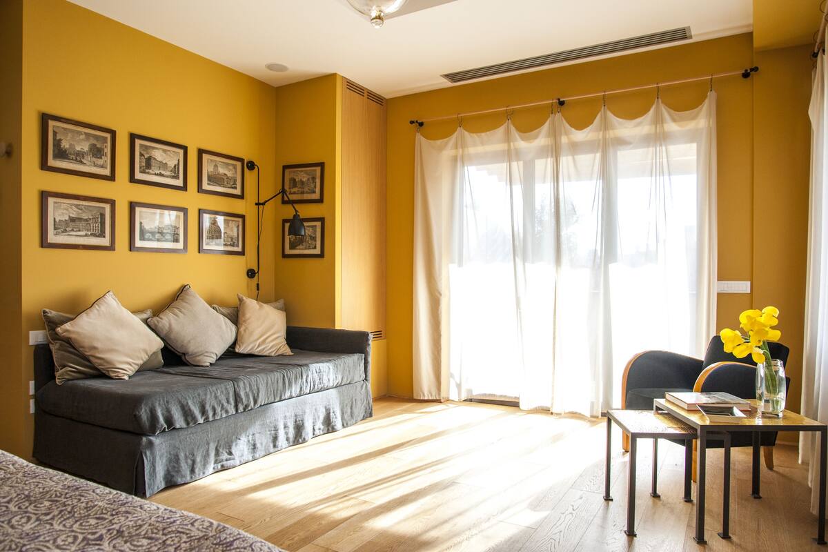 Panoramic Suite, 1 King Bed with Sofa bed, Terrace, City View | Living room | Flat-screen TV