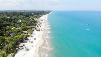 Beach nearby, white sand, beach shuttle, beach umbrellas