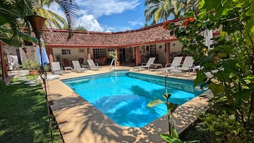 Outdoor pool, pool umbrellas, pool loungers