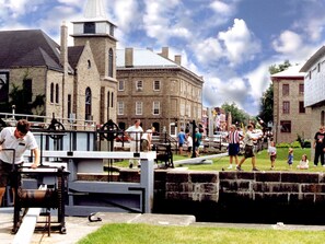 A historic building with a prominent tower and a lock system.