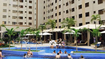 7 outdoor pools, open 9:00 AM to 10:00 PM, pool loungers