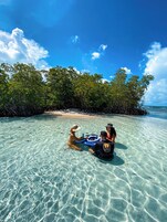 Beach nearby, white sand, beach towels