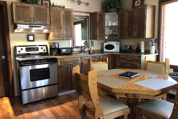 Microwave, toaster, cleaning supplies, freezer