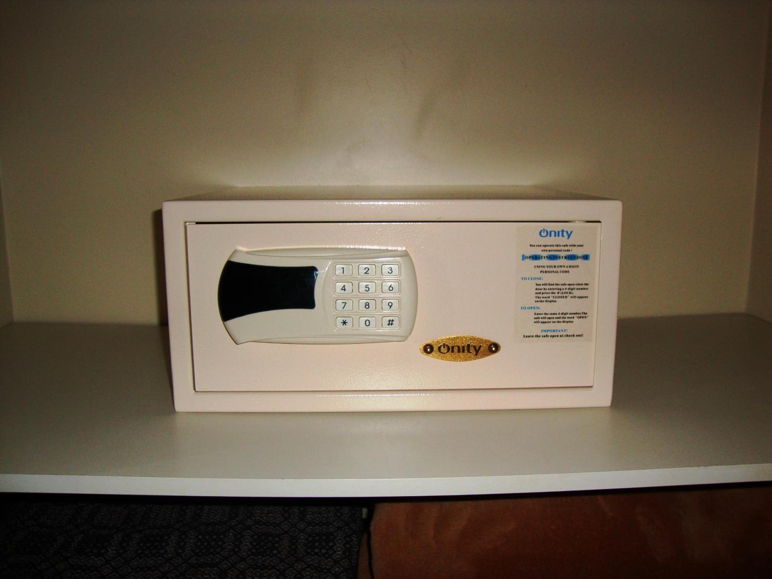 A microwave oven with a keypad and Onity branding on a white countertop.