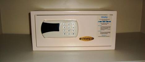 A microwave oven with a keypad and Onity branding on a white countertop.