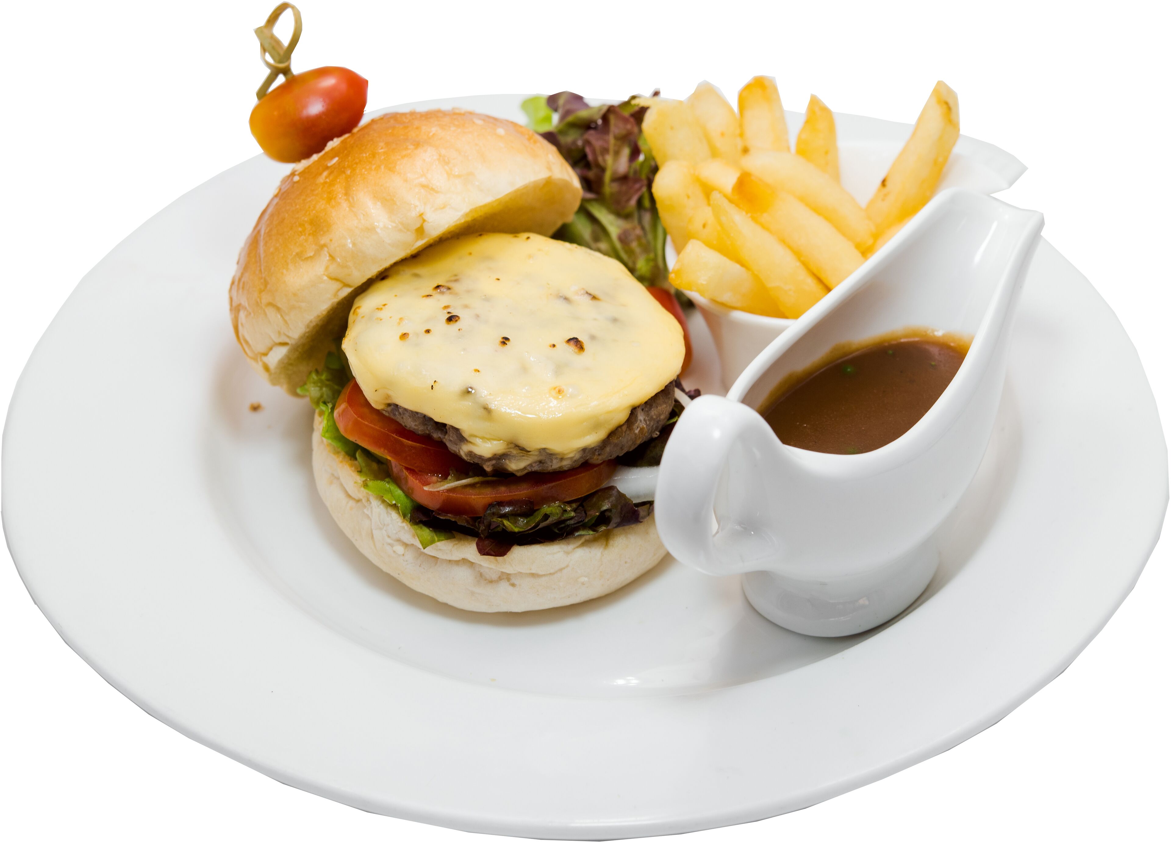 A hamburger with a side of fries and a small gravy boat on a white plate.