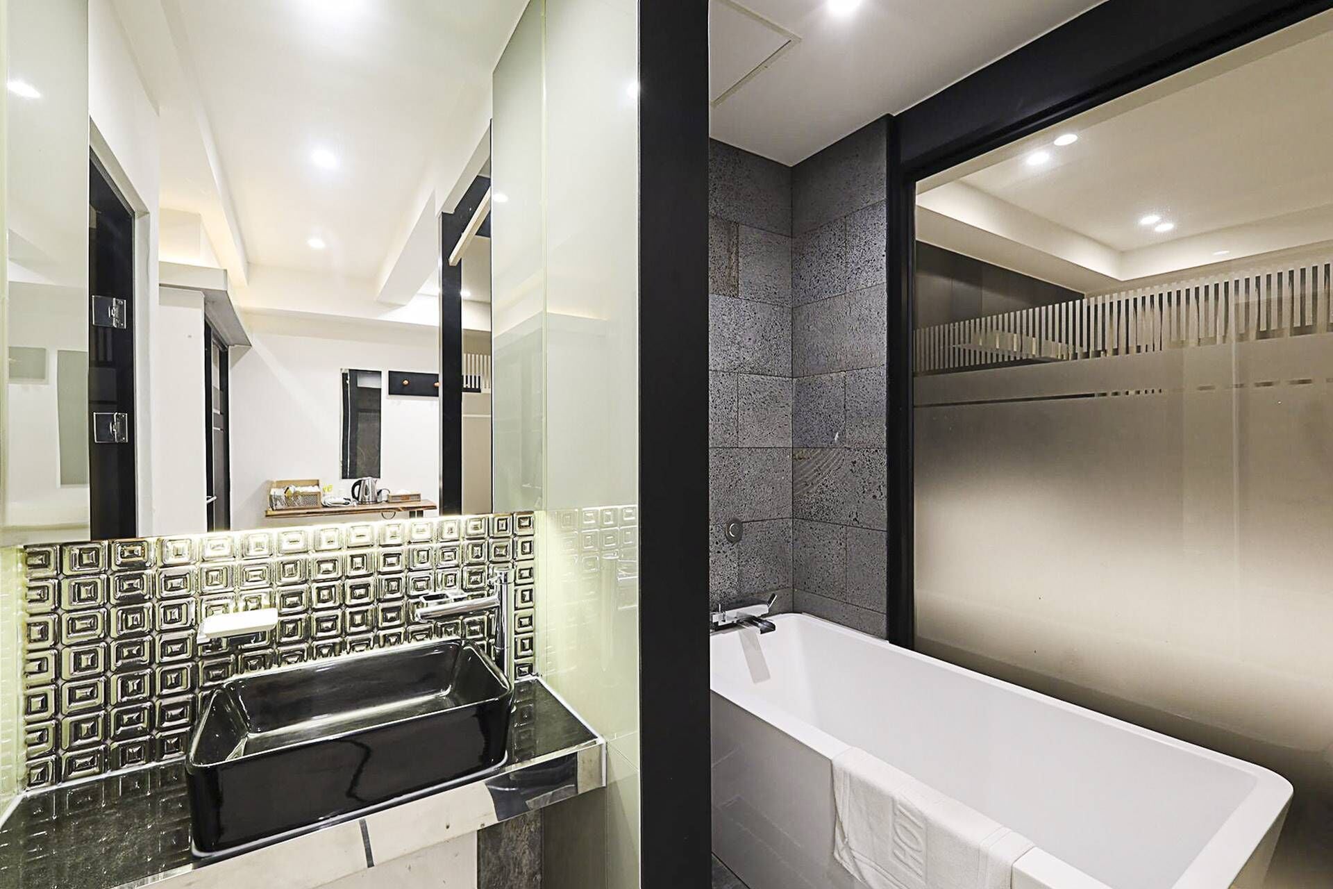 superior double room | bathroom | separate bathtub and shower, designer toiletries, hair dryer, bathrobes