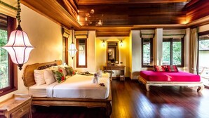 A bedroom with a large bed, bedside tables, a dresser, and a window with curtains. - Chivapuri Beach Resort (Ko Chang)