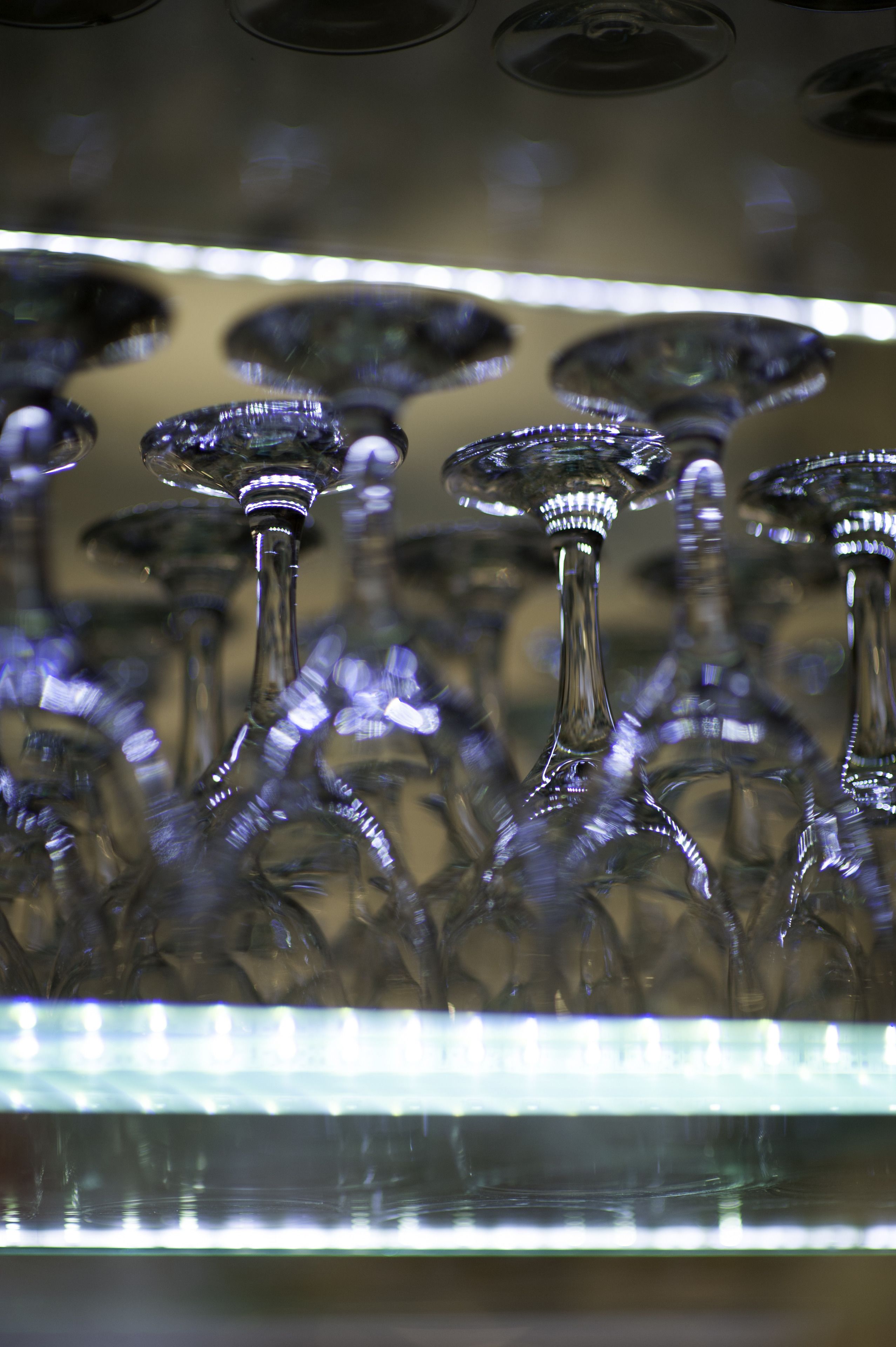 A collection of clear glassware with reflective surfaces, likely used for serving drinks.