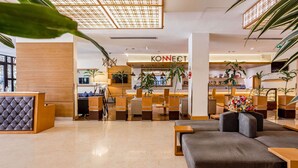 A modern hotel lobby with a reception desk, seating area, and a 'KONNECT' sign. - Ramada Addis, Addis Ababa (Addis Ababa)