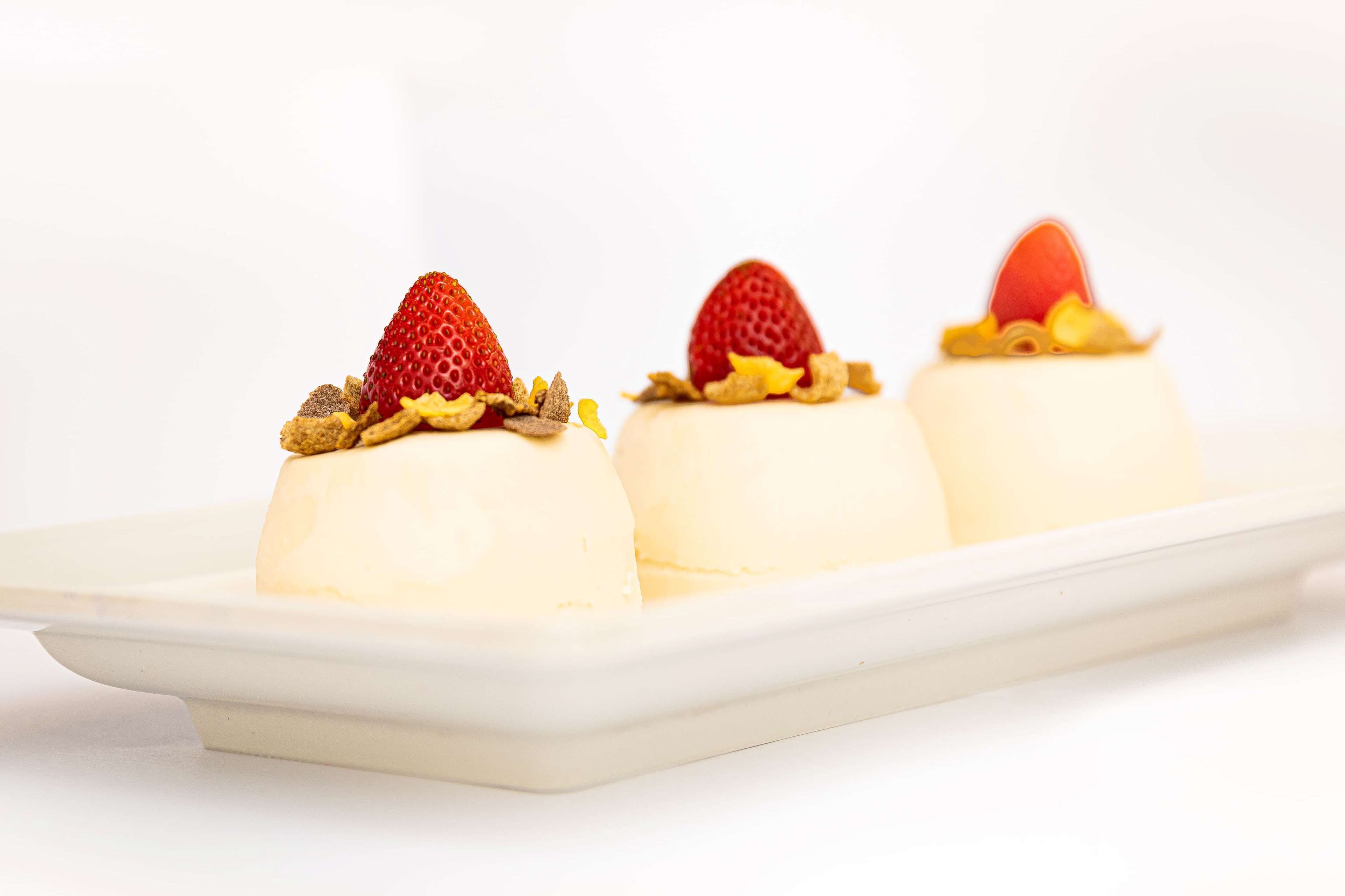 Three dessert items on a white plate.