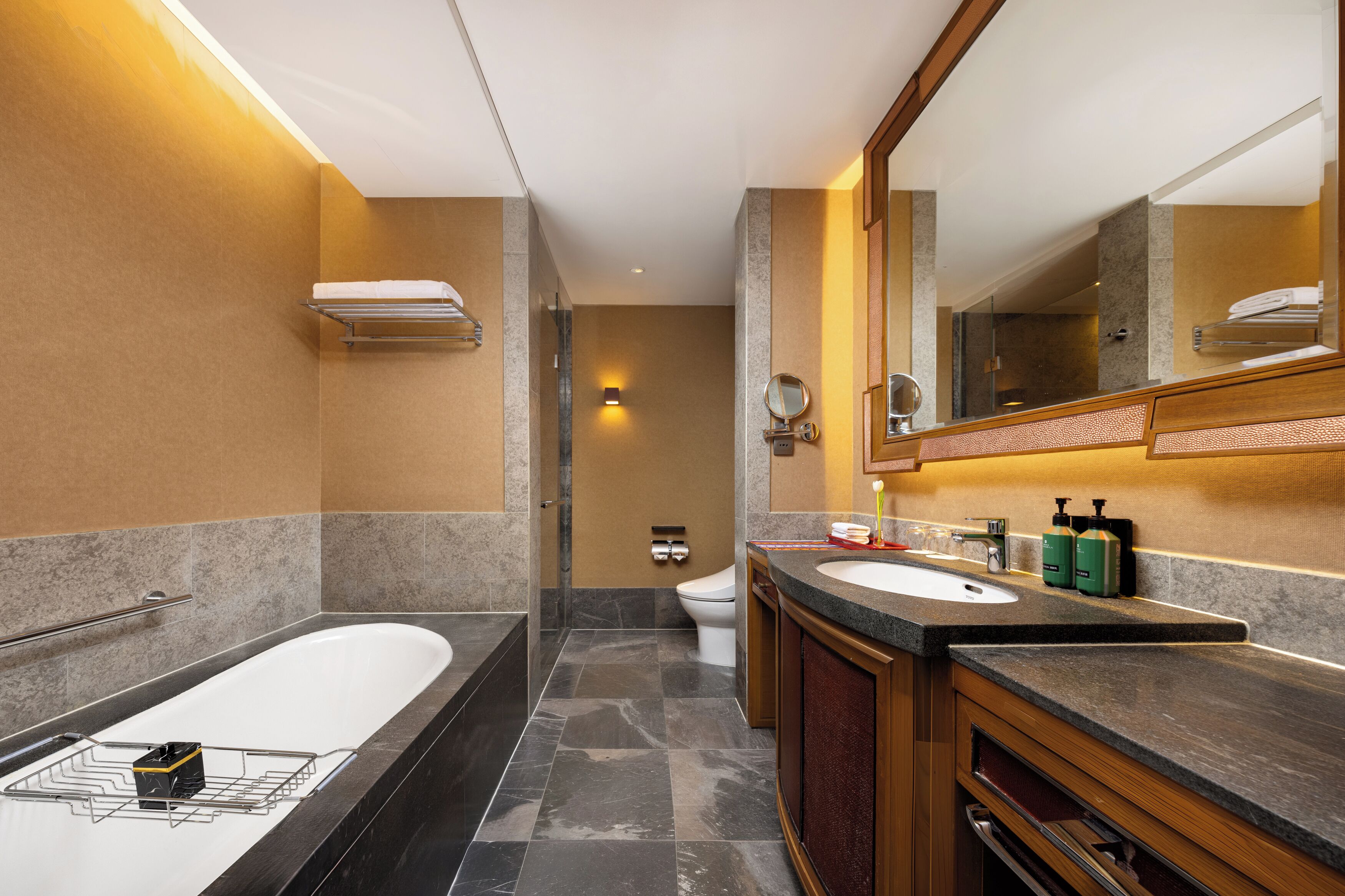 separate bathtub and shower, rainfall showerhead, designer toiletries