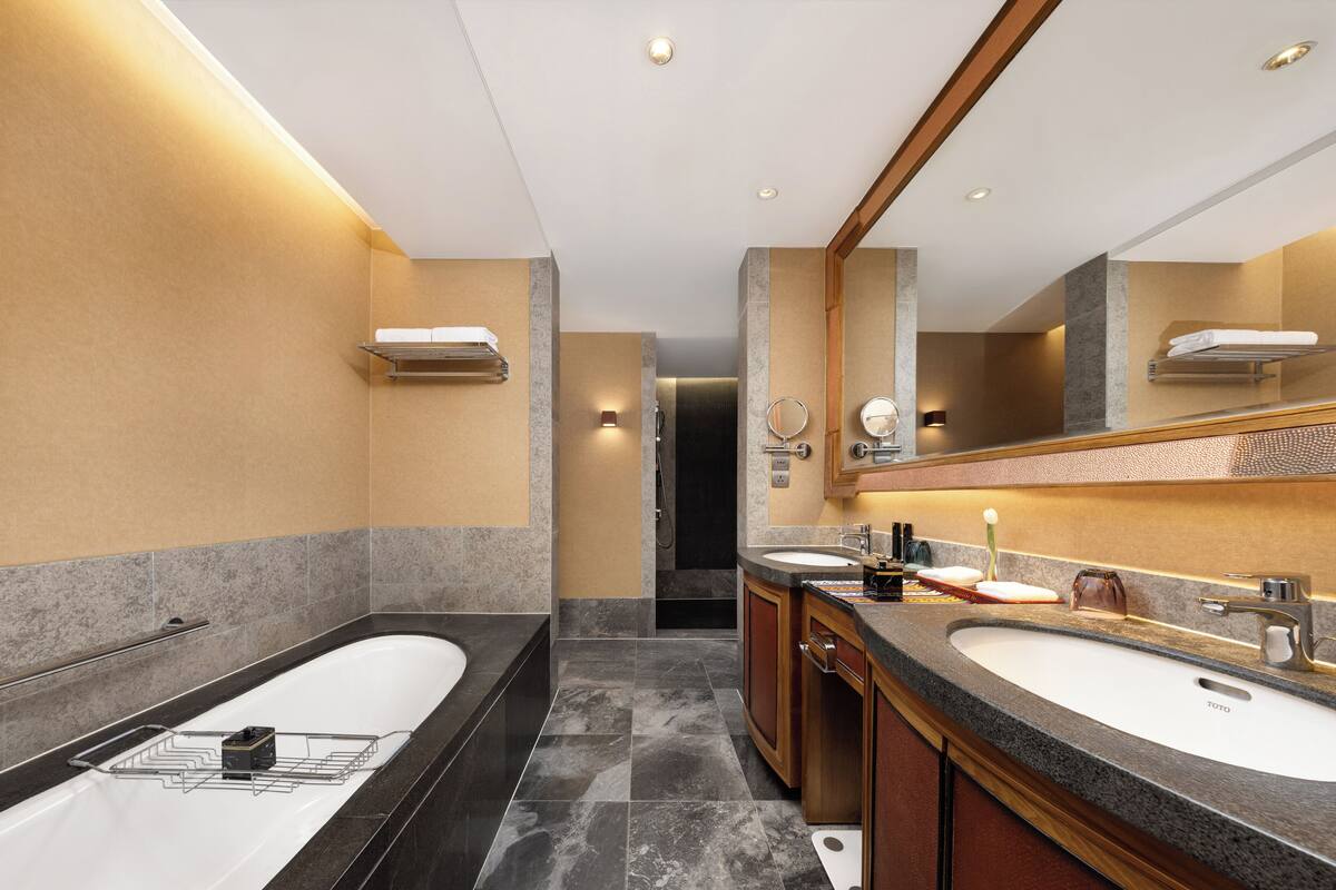 executive suite, 1 king bed | bathroom | separate bathtub and shower, rainfall showerhead, designer toiletries