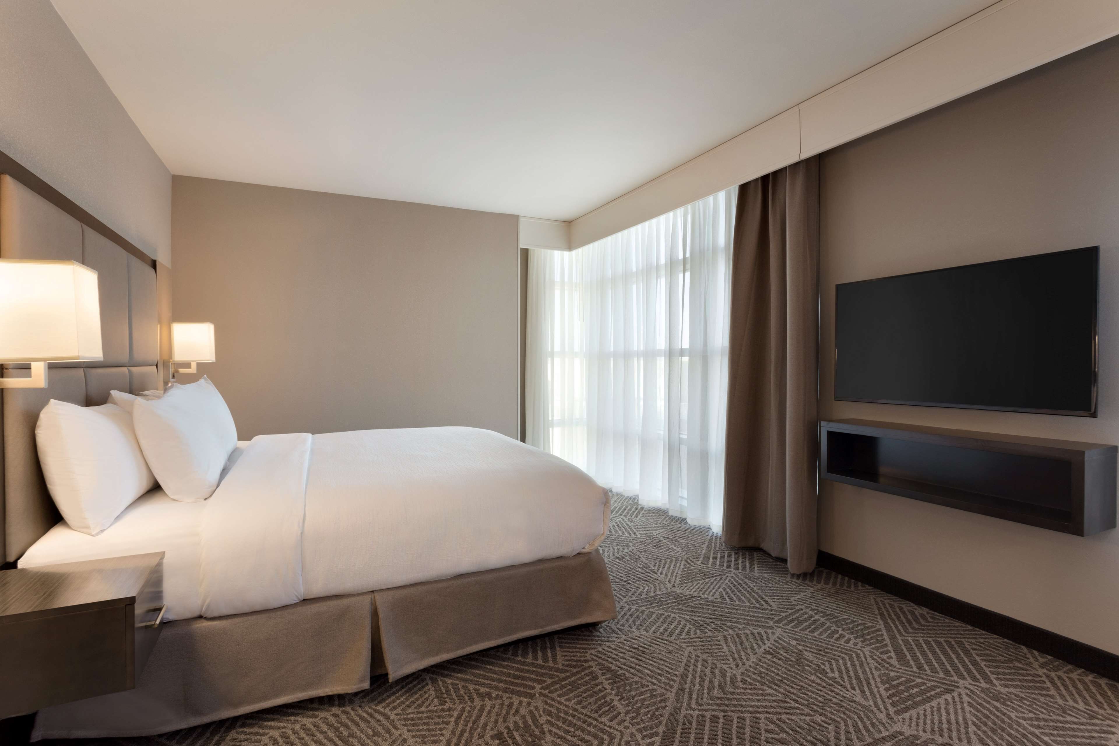 premium suite, 1 king bed, non smoking | in-room safe, desk, laptop workspace, iron/ironing board