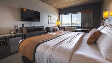 Premium bedding, desk, laptop workspace, iron/ironing board