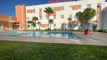 Outdoor pool, open 10:00 AM to 6:00 PM, pool loungers